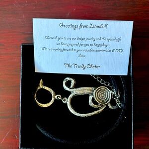 Black leather choker with silver circle design